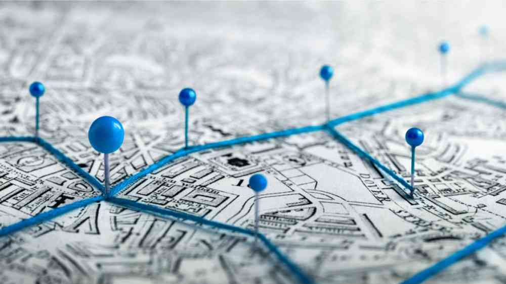 Blue pins on a city map