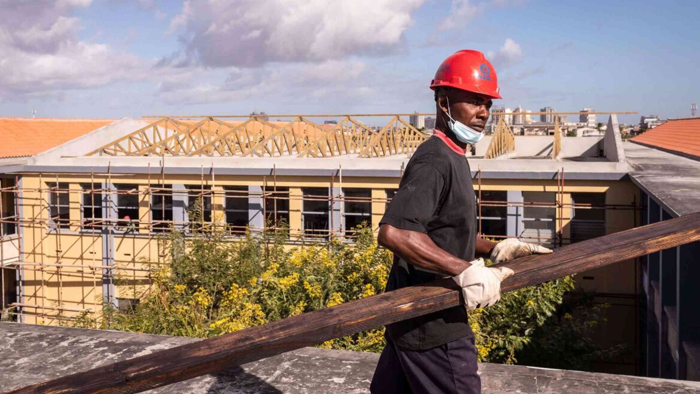 Worker on a roof in Mozambique