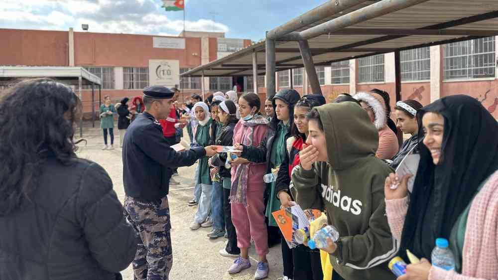 Students in Jordan receive guidebooks on how to stay safe during a disaster.