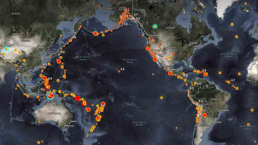 A map of North and Central America, Pacific Ocean, Australia with recent earthquakes location depicted as dots by the ESRI real time detection service.